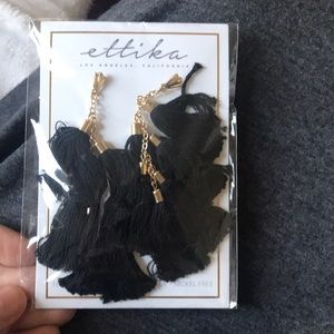 Black tassel earnings